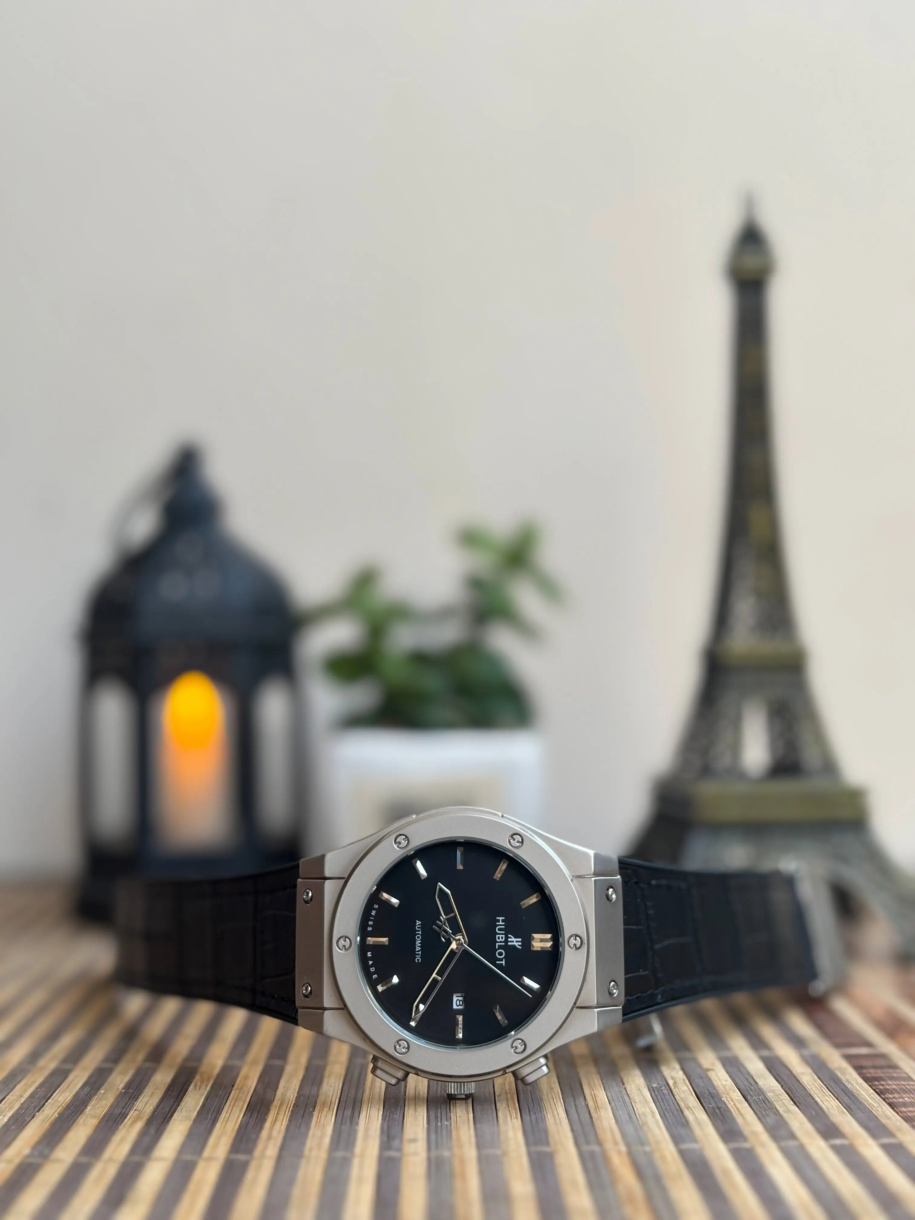 Classic fusion-style men’s watch with black dial, steel case and black leather strap